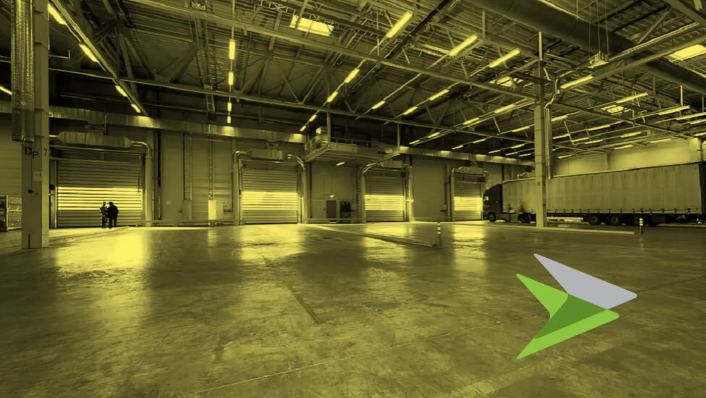 Inside of a warehouse showing a truck and 4 bay doors. In a yellow tone.