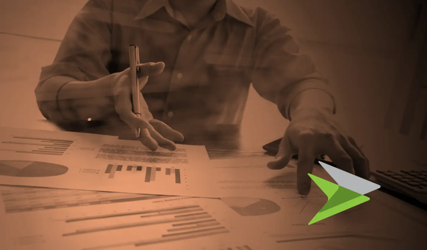 Persons pointing at reports on desk in a copper tone