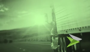 Truck driving towards bright sun, in a green tone