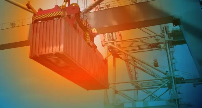 A container being lifted by a crane