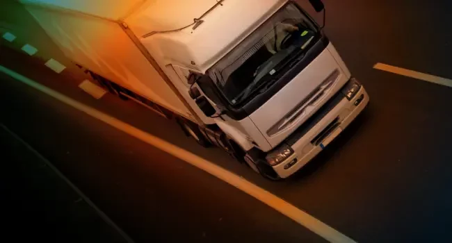 Paragraph – Truck Two A truck at an angle on the road moving towards camera